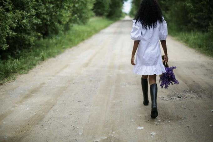 Woman walking in boots made with sustainable rubber