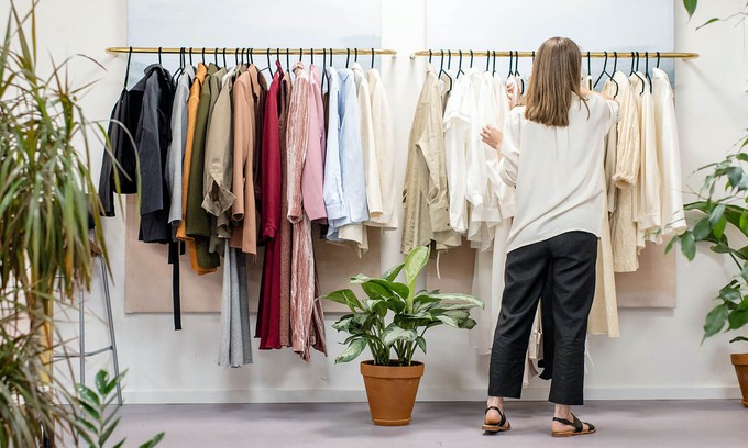 Consumer buying clothes consciously for their affordable sustainable wardrobe