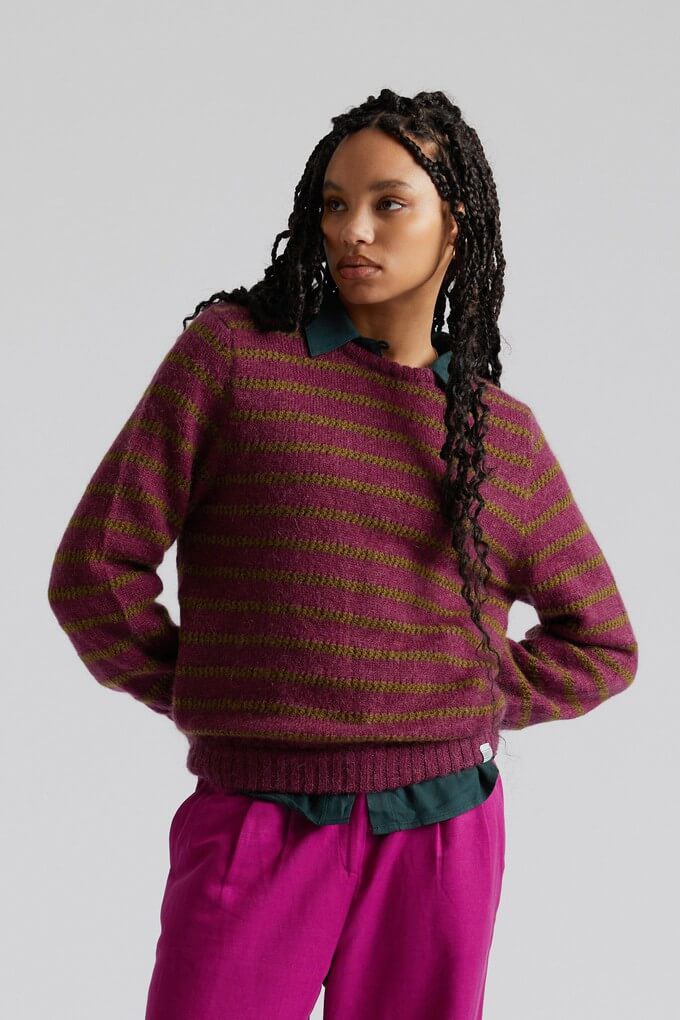 Consumer wearing a recycled nylon jumper