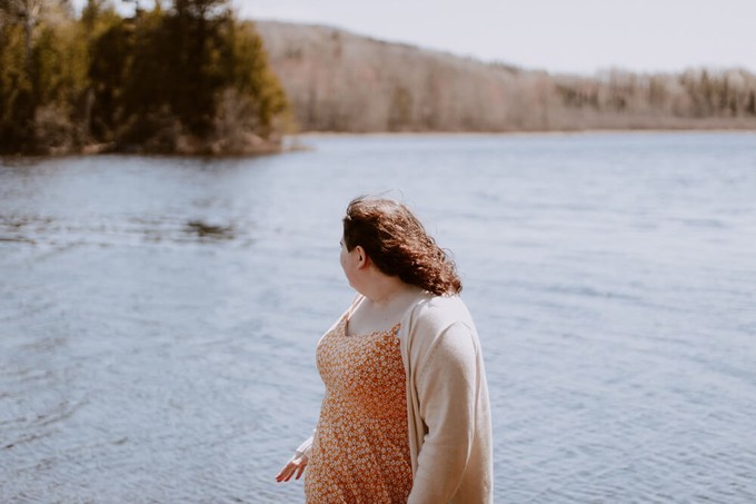Consumer wearing sustainable plus-size clothing in nature