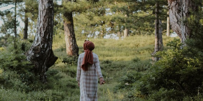 Fashion model surrounded by trees