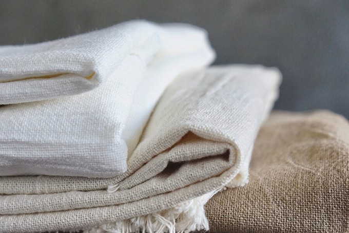 Gently folded linen pieces to show how to care for linen