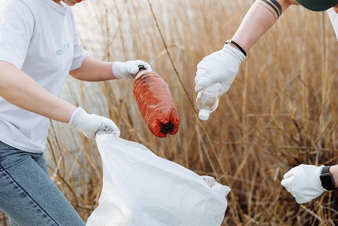 Plastic bottles being picked up to make recycled polyester clothing