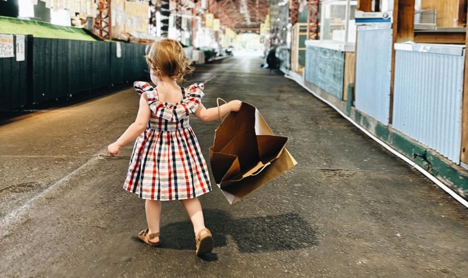 Toddler walking while wearing some of the best ethical children clothing