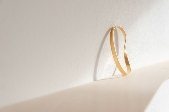 Swirling wind bangle bracelet gold plated from Julia Otilia